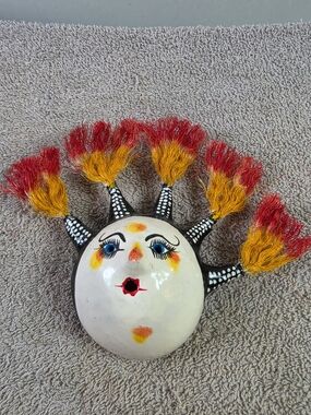 Handcrafted Coconut Shell Sun Face Wall Art with Red and Yellow Tassels